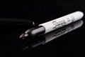 Sharpie permanent marker pen isolated on black Royalty Free Stock Photo